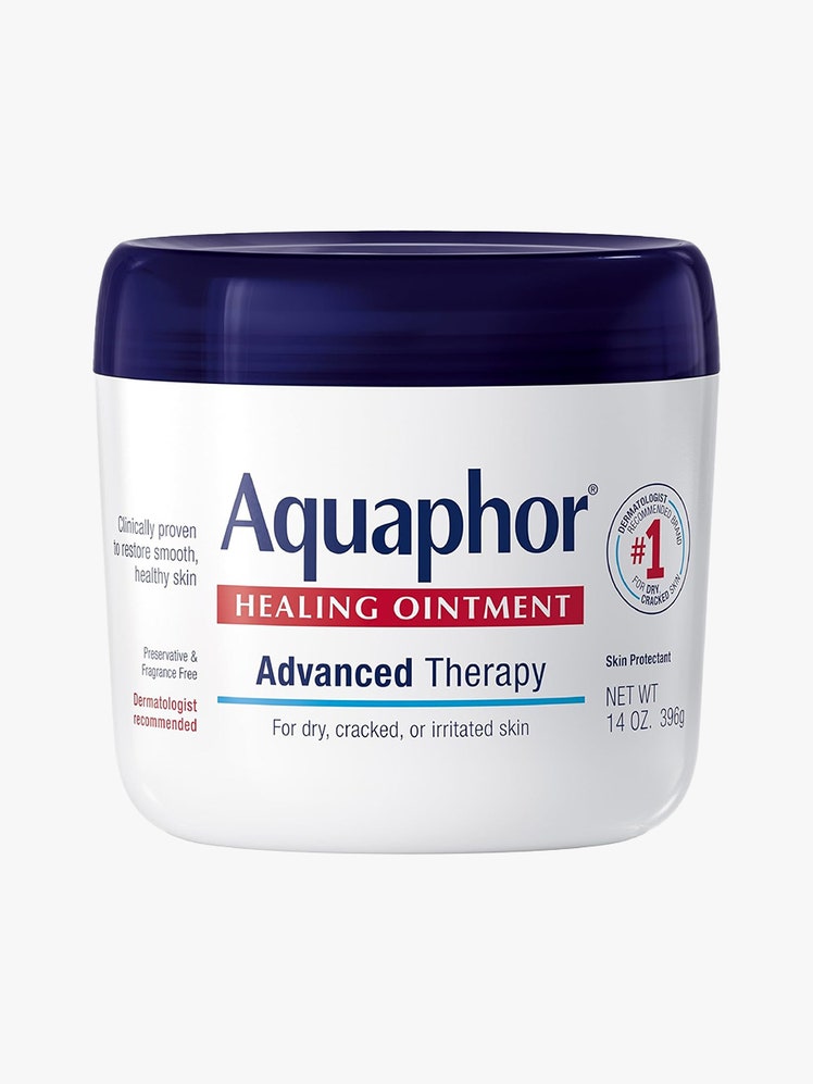 Aquaphor white jar with navy lid on light gray background