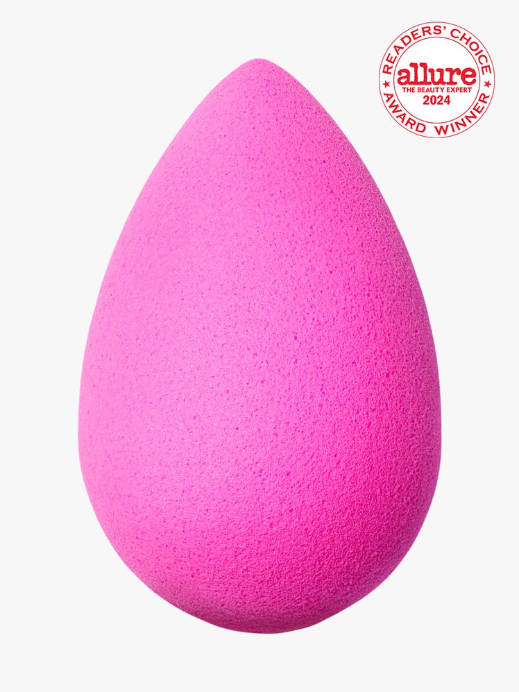 Beautyblender The Original Beautyblender bright pink makeup sponge on light gray background with white and red Allure...