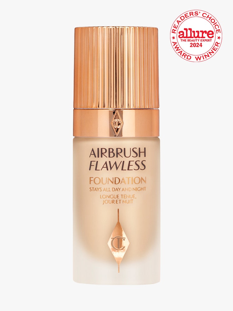 Charlotte Tilbury Airbrush Flawless Longwear Foundation bottle of foundation with gold lid on light gray background with...