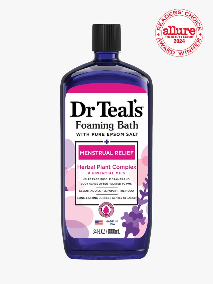 Dr Teal’s Foaming Bath Menstrual Relief with Herbal Plant Complex and Essential Oils blue bottle with white, pink, and purple label and black cap on light gray background with white and red Allure Readers' Choice Award seal in the top right corner