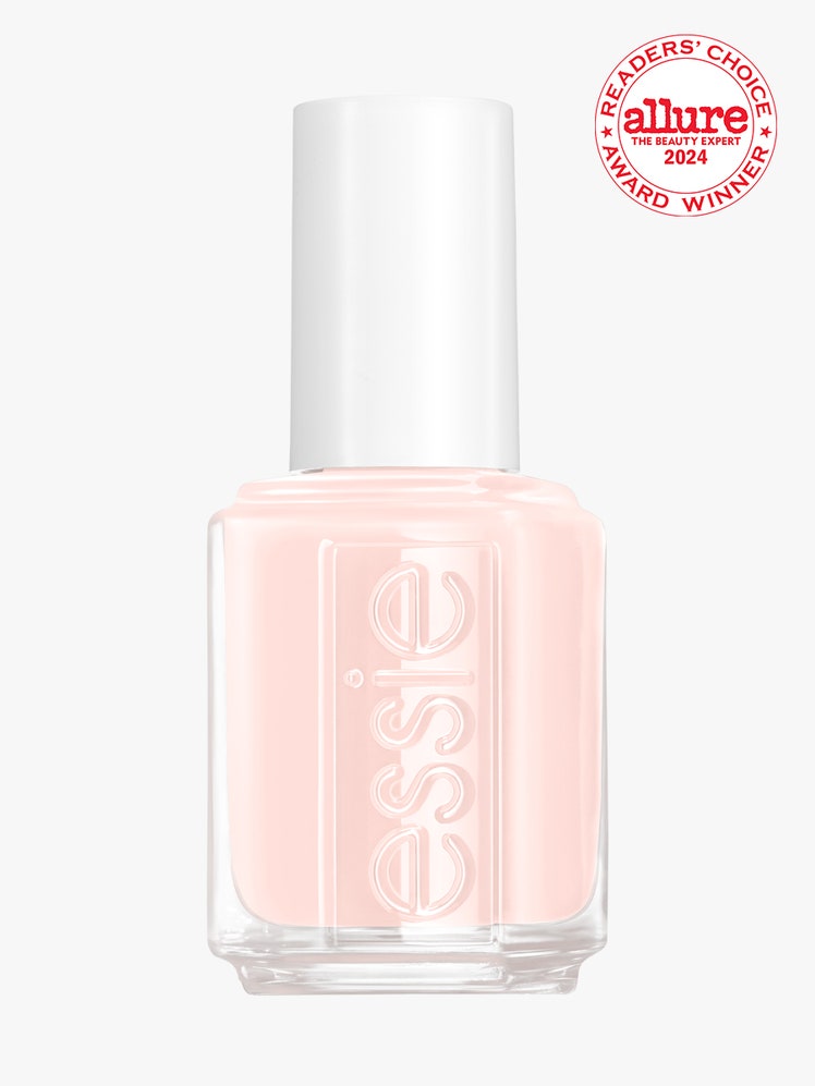 Essie bottle of baby pink nail polish with white cap on light gray background with white and red Allure Readers' Choice...