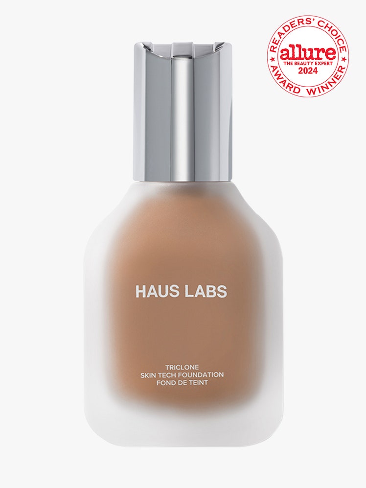 Haus Labs Triclone Skin Tech Medium Coverage Foundation cloudy bottle of foundation with silver cap on light gray...