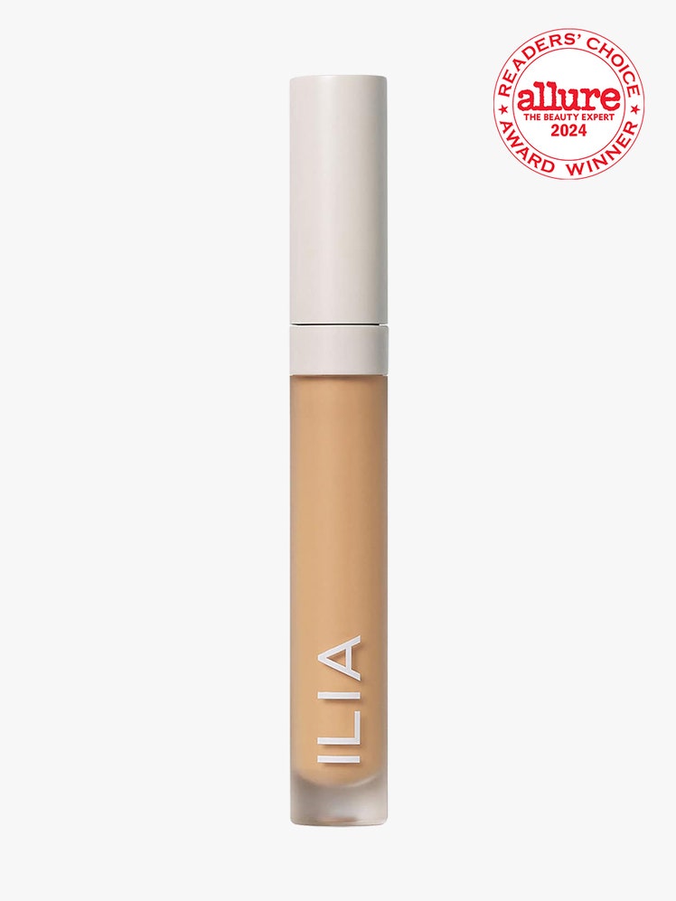 Ilia True Skin Serum Concealer vial of concealer with beige cap on light gray background with white and red Allure...