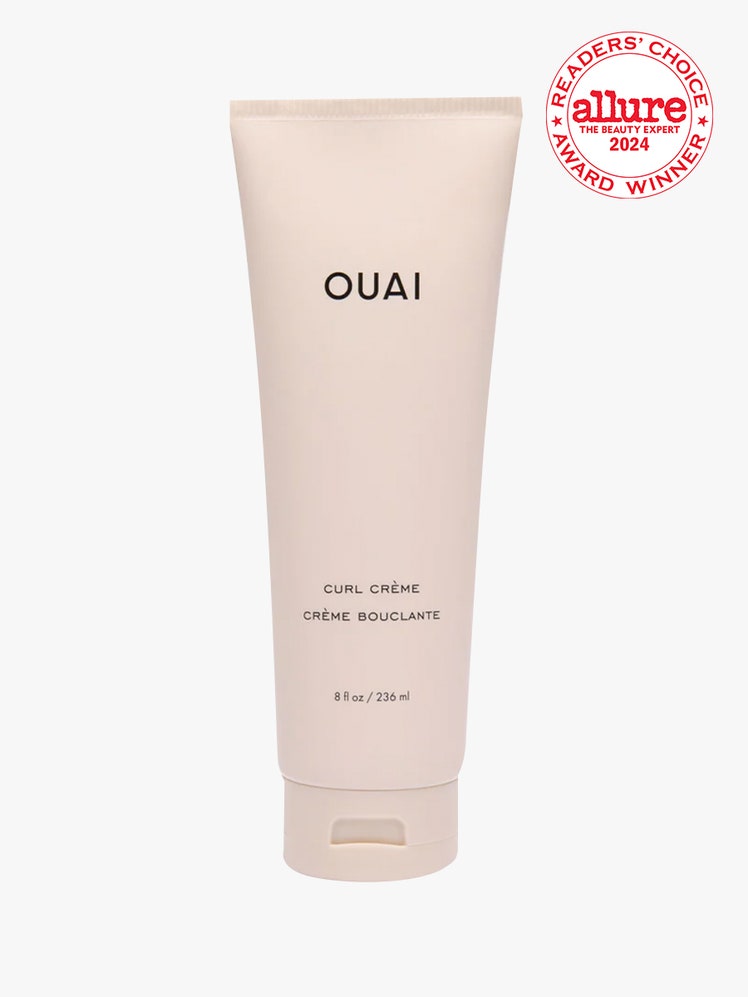 Ouai Curl Creme light pink tube on light gray background with white and red Allure Readers' Choice Award seal in the top right corner