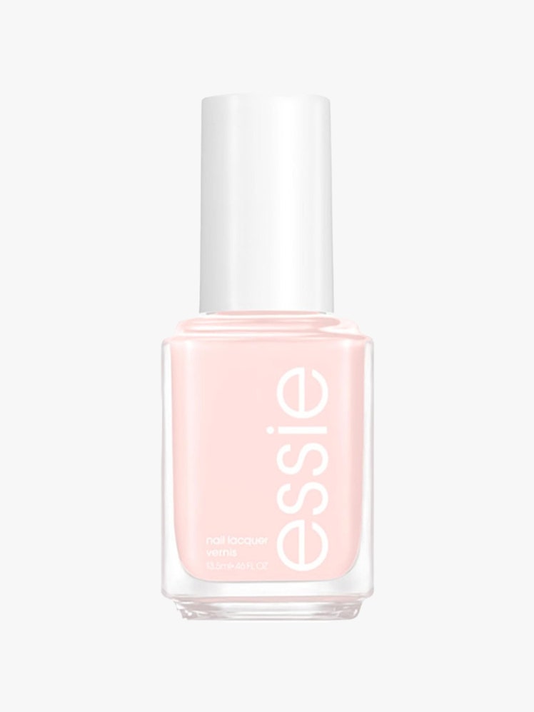 Essie Nail Polish in Ballet Slippers bottle of light pink nail polish on light gray background