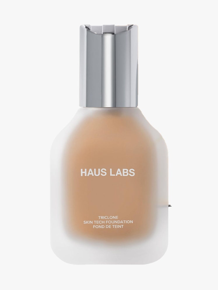 Haus Labs Triclone Skin Tech Foundation cloudy bottle of foundation with silver cap on light gray background