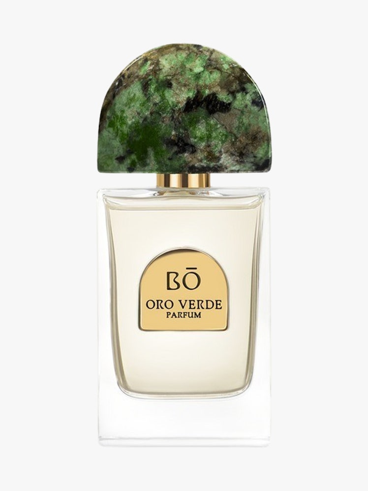 Oro Verde Parfum clear bottle with green top on light grey background