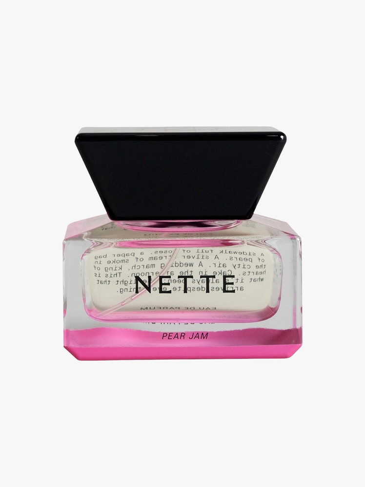 Pear Jam Eau de Parfum pink and clear jar with black top on light grey background