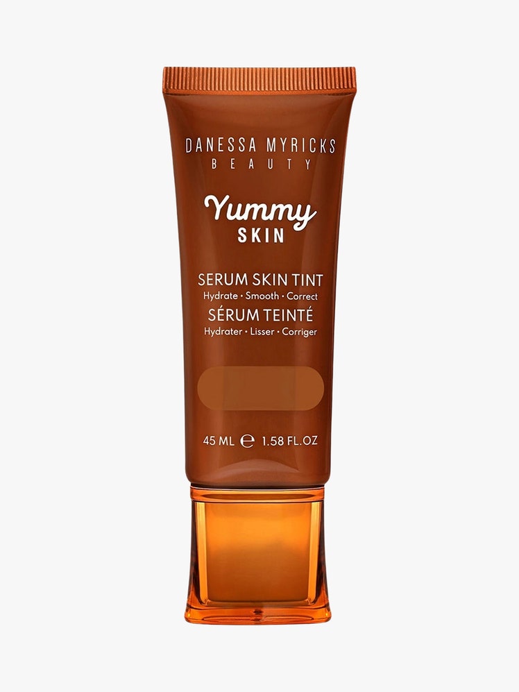 Yummy Skin Soothing Serum Skin Tint Foundation brown tube on light grey background