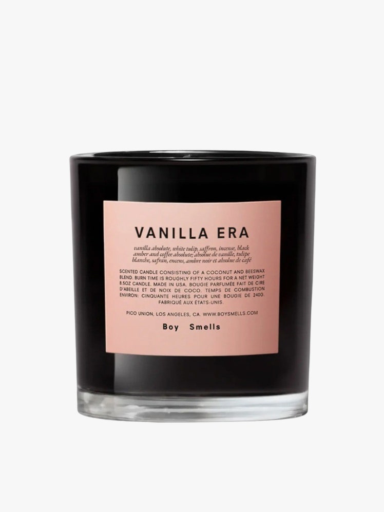 Vanilla Era Scented Candle black candle with pink label on light grey background