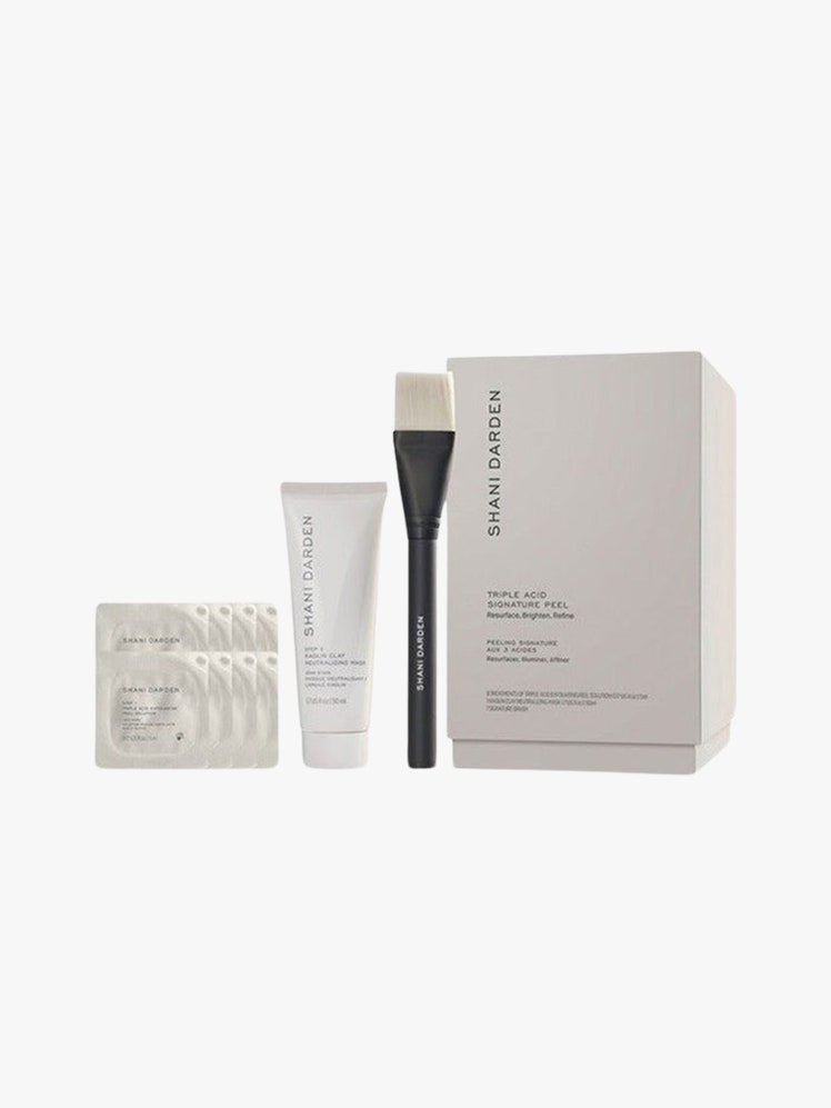 Triple Acid Signature Peel brush tube packet and box on light grey background