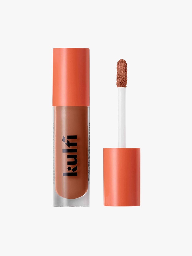 Main Match CreaseProof LongWear Hydrating Concealer brown makeup with orange top on light grey background