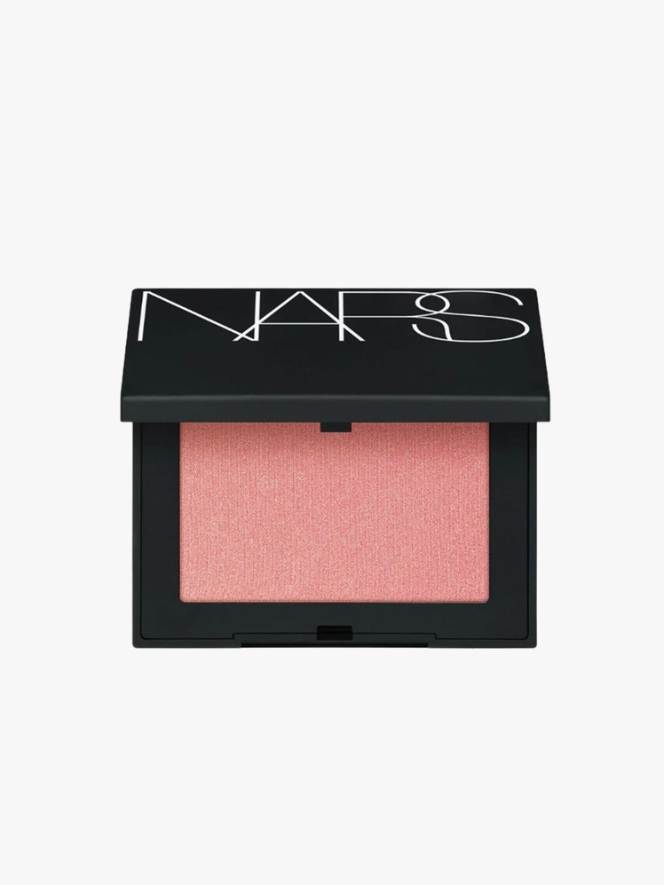 Powder Blush black case with pink makeup on light grey background