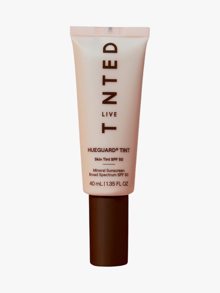 Hueguard Skin Tint SPF 50  light brown tube with dark brown cap on light grey background