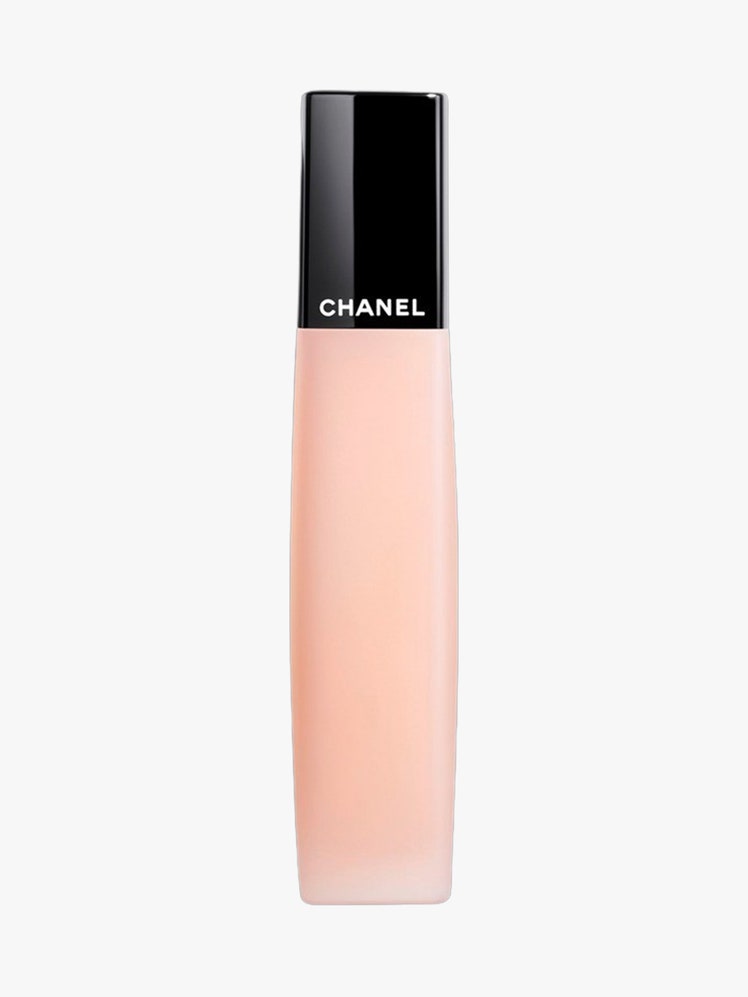 Chanel L'Huile Camelia pink tube with black top on light grey background