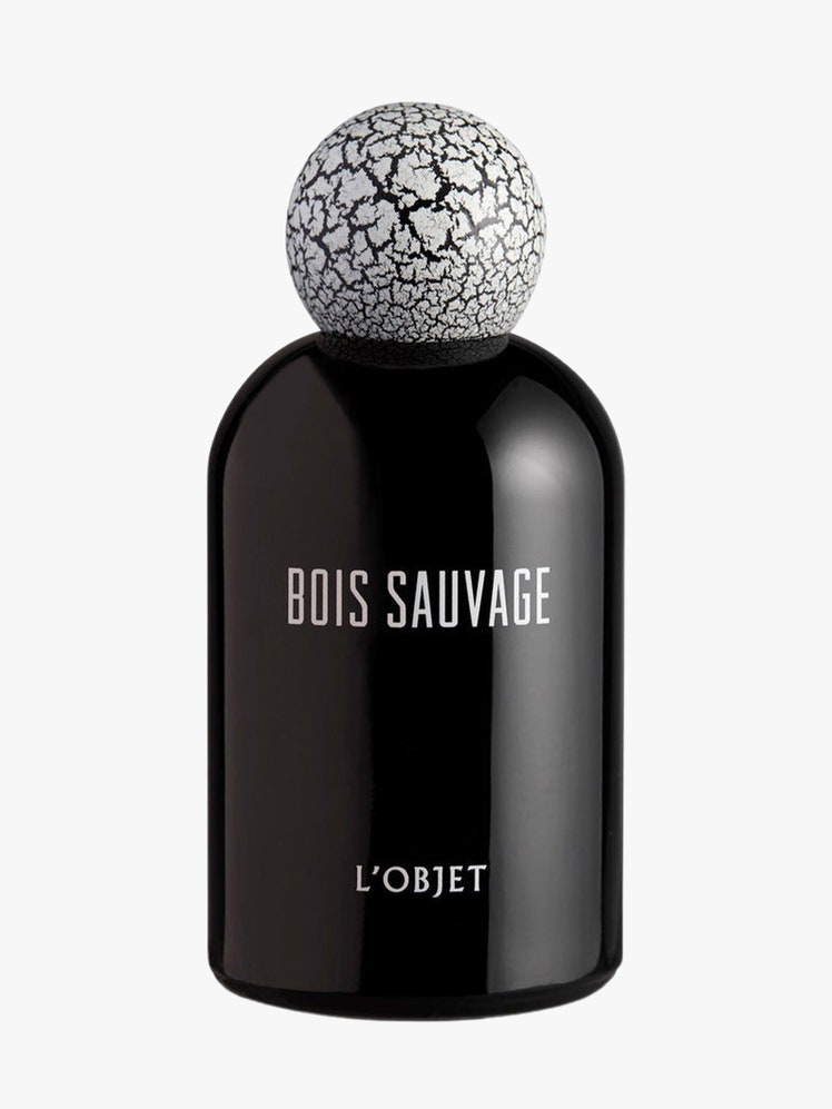 Bois Sauvage Eau de Parfum black bottle on light grey background