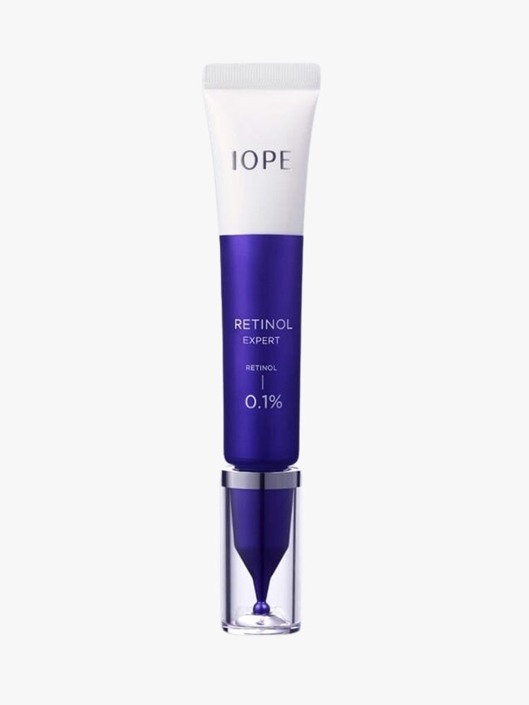 Retinol Expert 0.1 blue and white tube on light grey background