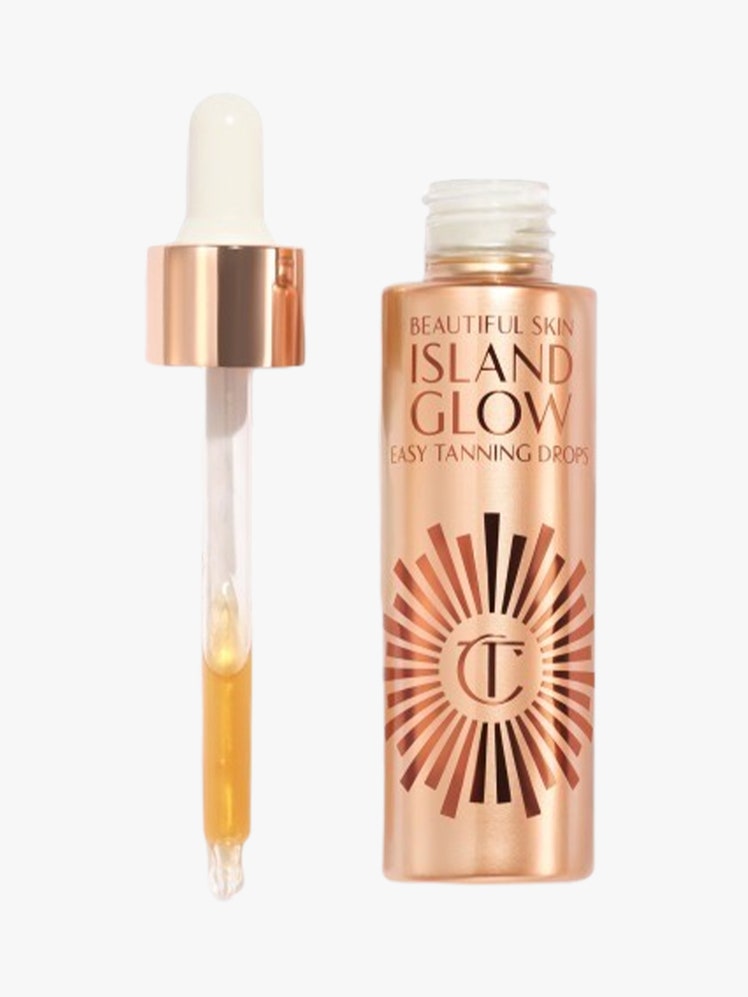 Island Glow Tanning Drops gold serum tube on light grey background