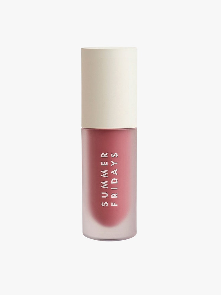 Dream Lip Oil red container with off white cap on light grey background