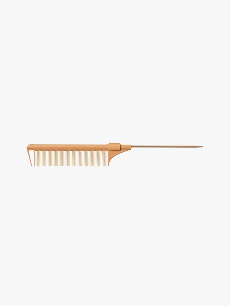 Retractable Comb tan comb on light grey background