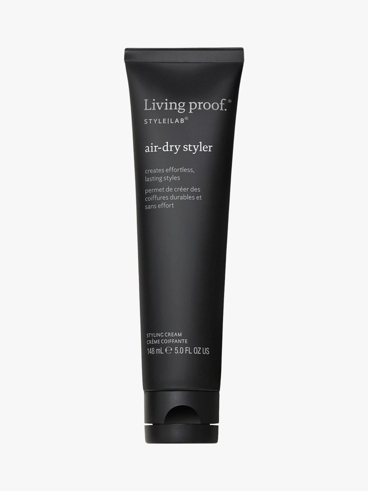 AirDry Hair Styling Cream black tube on light grey background