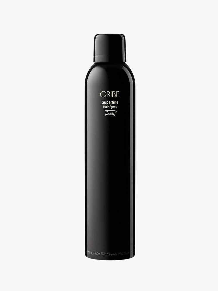 Superfine Hair Spray black bottle on light grey background