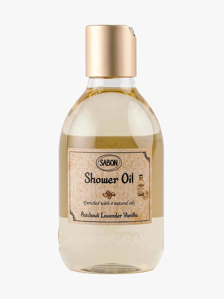 Sabon Patchouli Lavender Vanilla Shower Oil bottle of beige shower oil with light brown label and cap on light gray...