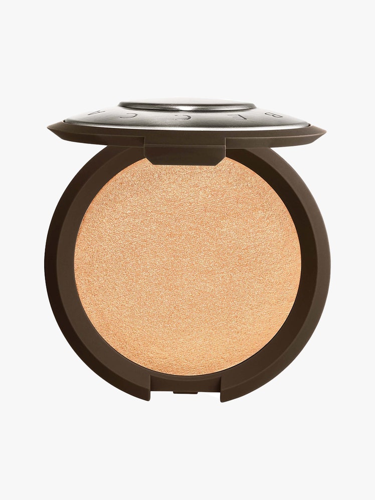 Smashbox x Becca Shimmering Skin Perfector Pressed Highlighter in Champagne Pop round brown compact of gold highlighter...