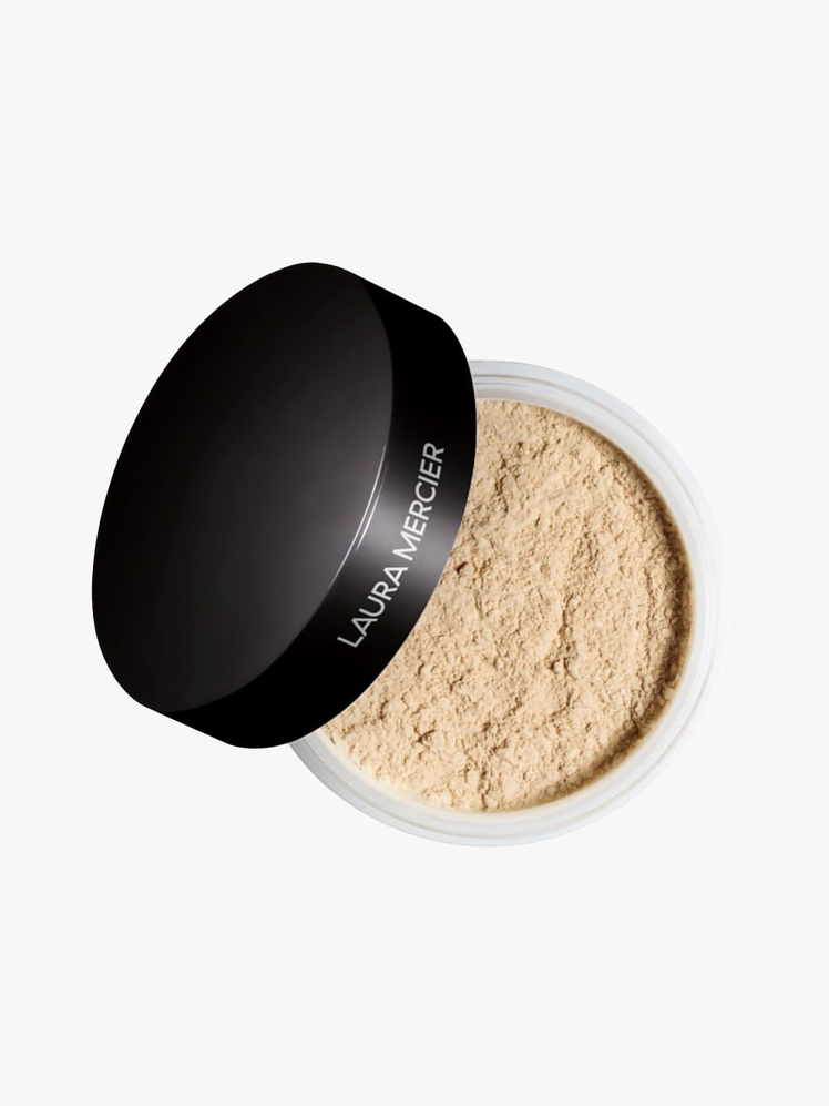 Laura Mercier Translucent Loose Setting Powder in clear pot with branded lid on light gray background