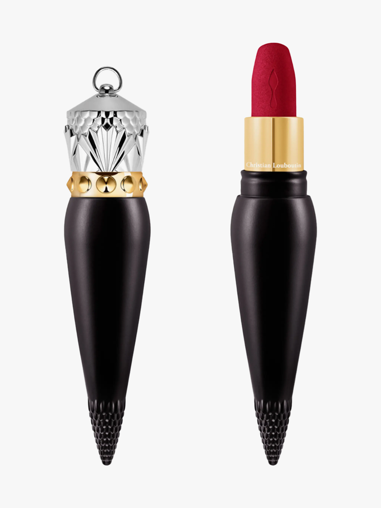 Rouge Louboutin Velvet Matte Lipstick in black and gold lipstick bullet with silver cap on light gray background