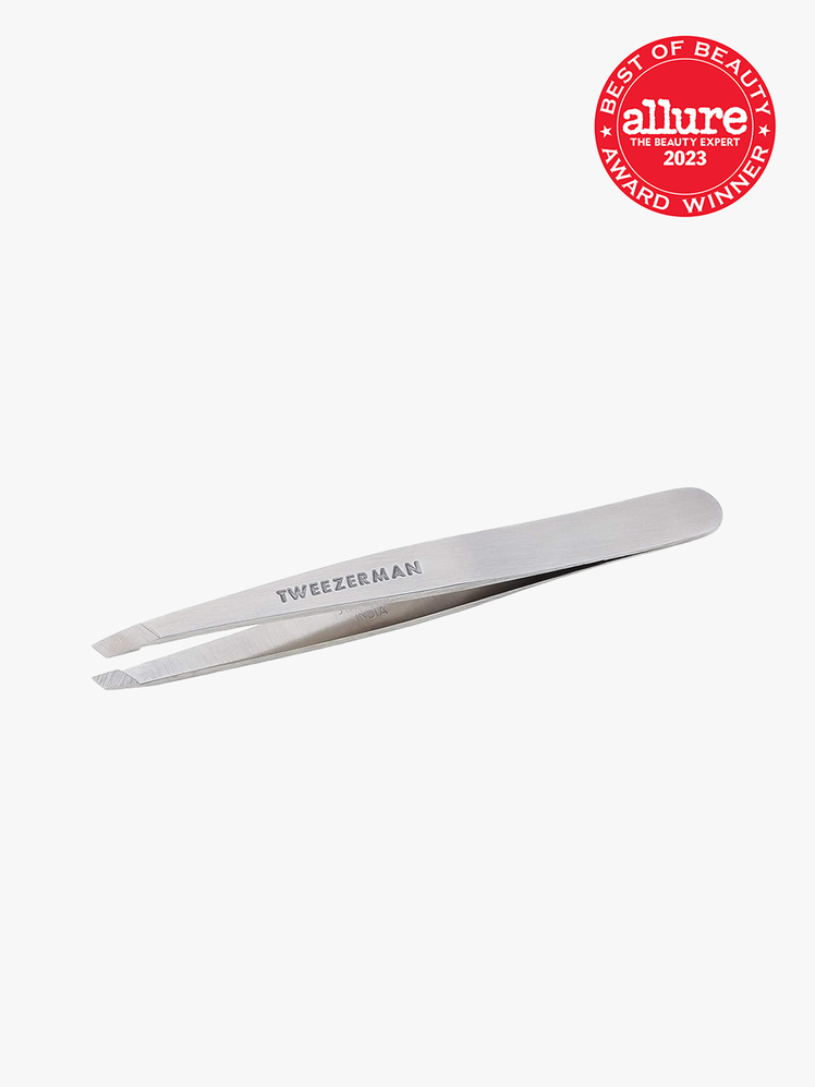 Slant Tweezers in branded silver color way on light gray background with allure 2023 best of beauty seal in red and white